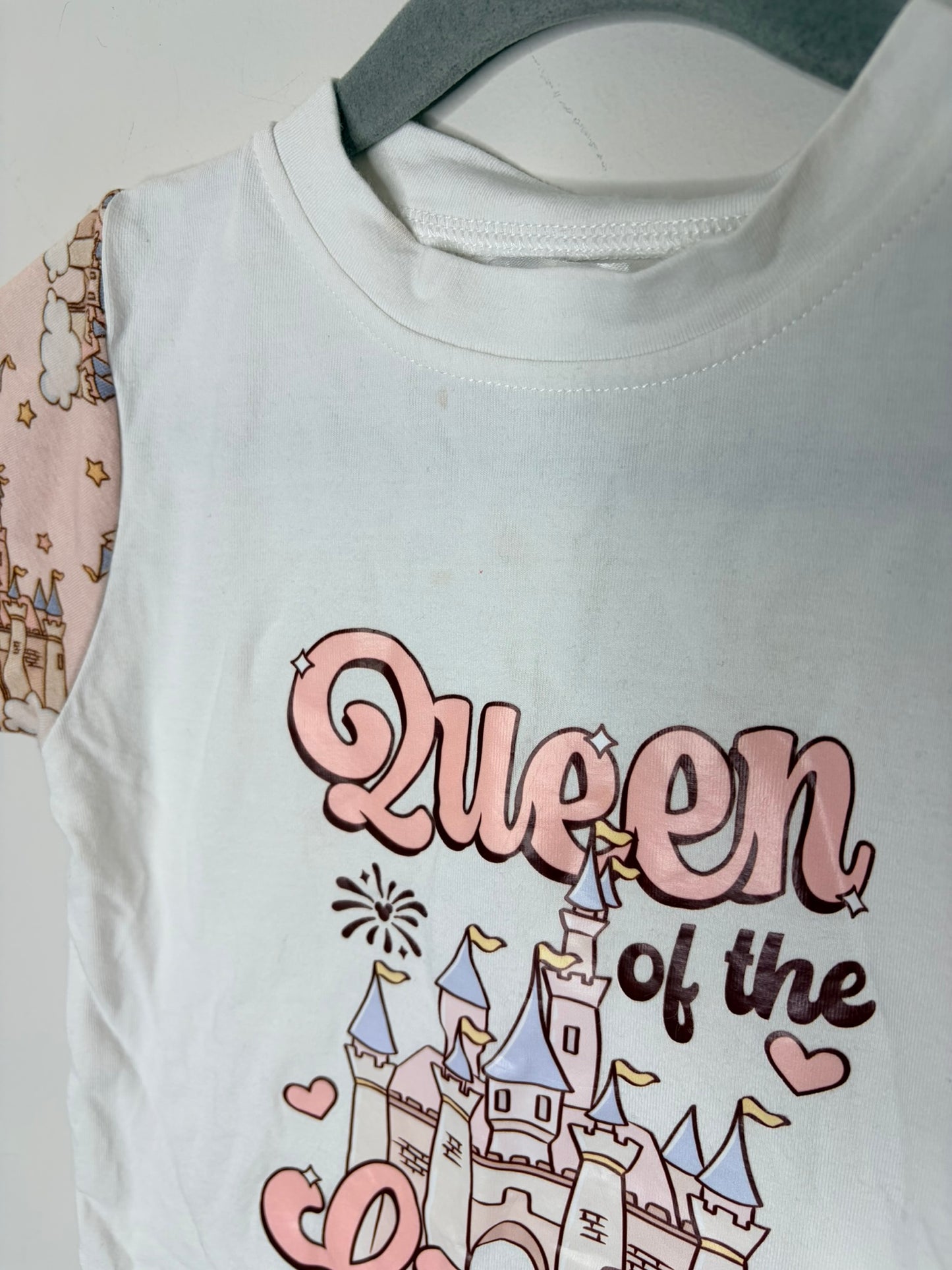 White T-shirt with pink sleeves featuring a 'Queen of the Castle' design and castle illustration.