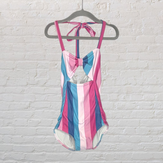 Women's one-piece swimsuit with pink, blue, and white vertical stripes, featuring a cut-out design and bow detail.