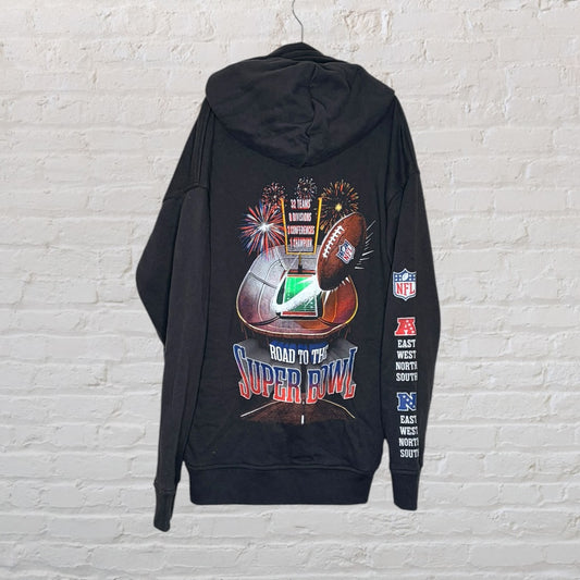 Black NFL hoodie featuring Road to the Super Bowl graphic with football and stadium design on the back.