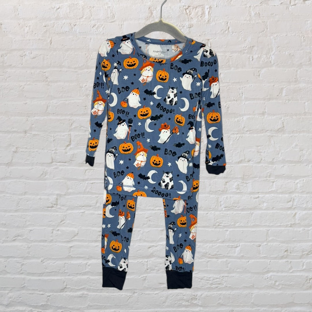 Blue pajama set with Halloween-themed prints featuring ghosts, pumpkins, and stars hanging on a hanger.