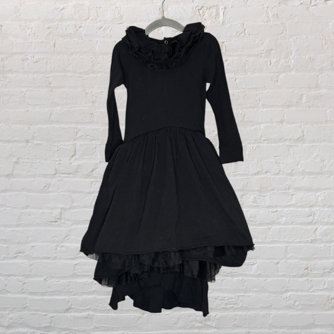 Elegant black gothic dress with ruffled neckline and layered skirt, hanging on a hanger.