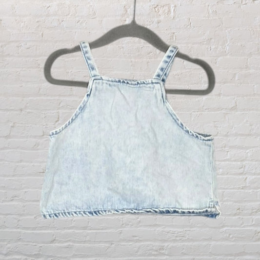 Light blue denim crop top with thick straps, displayed on a hanger.