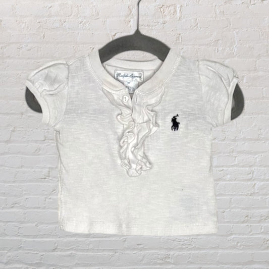 White Ralph Lauren polo shirt with ruffled front and embroidered logo, featuring short sleeves.