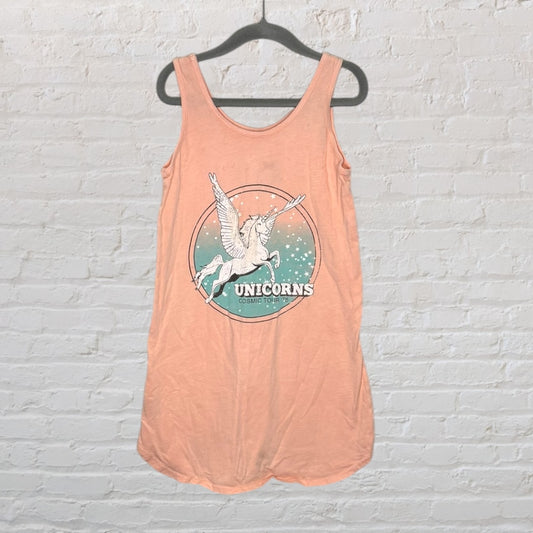 Peach tank top with a graphic of a winged unicorn and 'Unicorns Cosmic Tour 75' text, hanging on a black hanger.