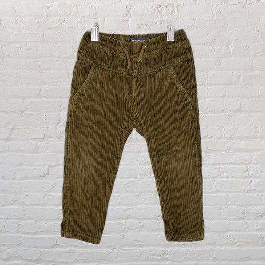 Olive green corduroy pants with drawstring waist displayed on a hanger.