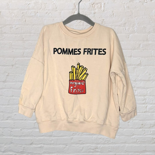 Beige sweatshirt with 'Pommes Frites' text and a graphic of fries in a red carton labeled 'organic frites'.