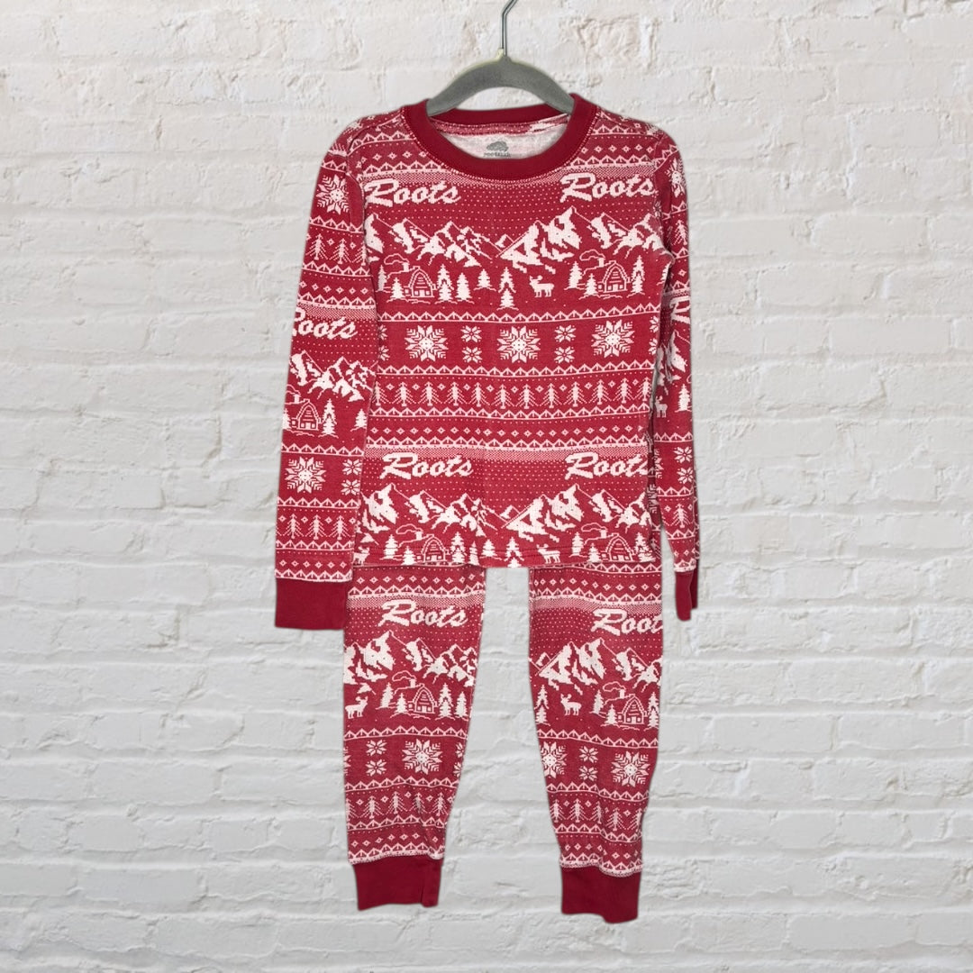Red and white patterned Roots pajama set with winter-themed designs, featuring long sleeves and pants.