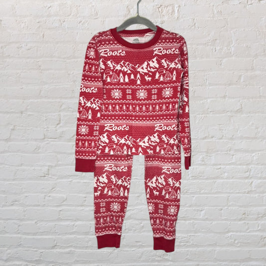 Red and white patterned Roots pajama set with winter-themed designs, featuring long sleeves and pants.