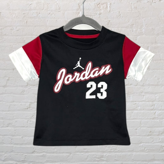 Black Jordan t-shirt with red and white accents, featuring the Jordan logo and number 23.
