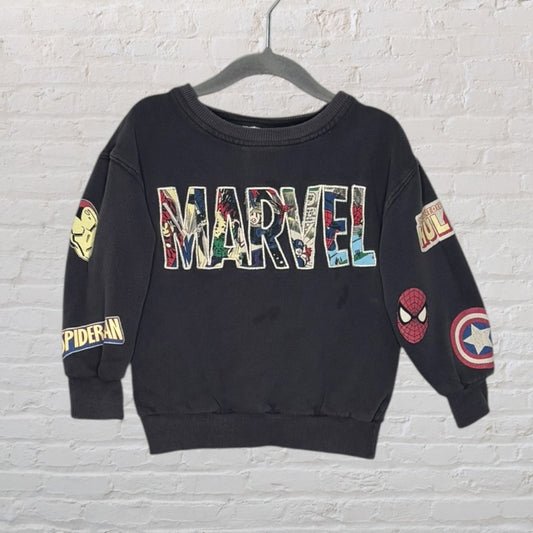Black sweatshirt with Marvel logo and comic character patches including Spider-Man and Captain America on sleeves.