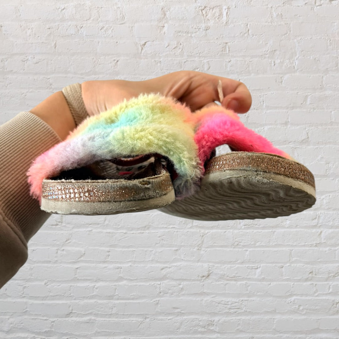 Steve Madden gold slide sandals with rainbow fluffy straps.