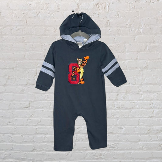 A dark gray hooded onesie featuring Tigger from Disney, with stripes on sleeves and an embroidered patch.