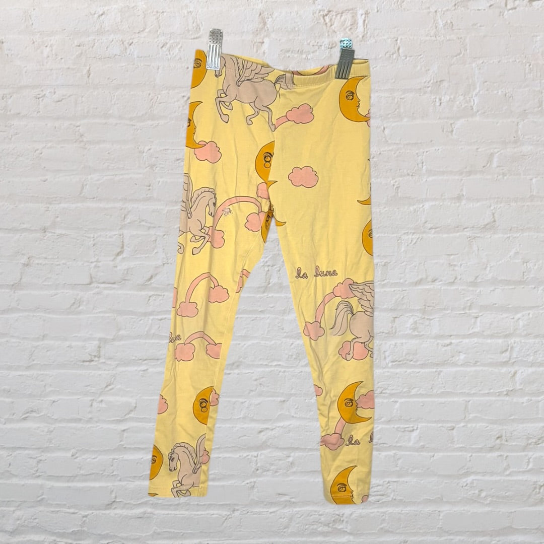 Multicoloured kids sleepwear set with various graphic designs including mermaids, cacti, and whimsical creatures.