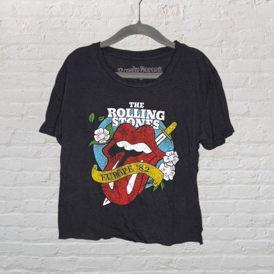 A black Rolling Stones Europe '82 T-shirt with a colorful tongue and floral graphic.