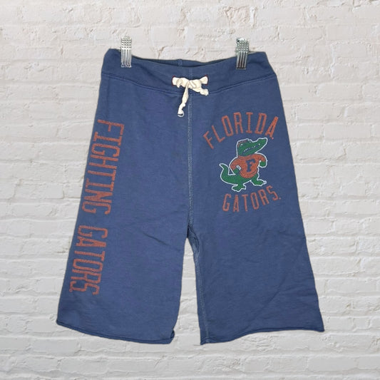 Blue Florida Gators shorts with Fighting Gators text and logo, featuring a drawstring waistband.