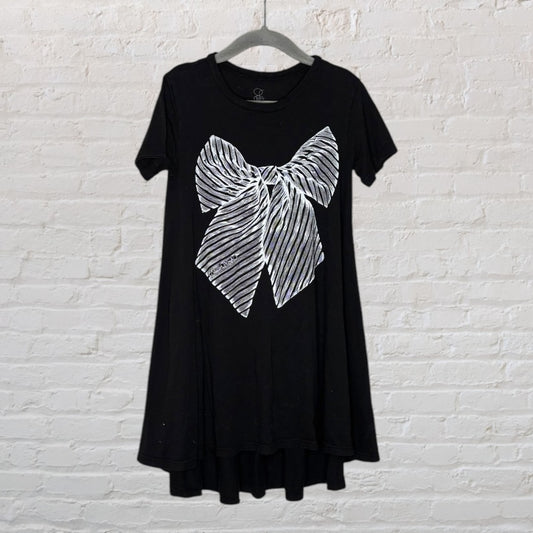 Black t-shirt dress with large silver bow print on the front, short sleeves, hanging on a hanger.