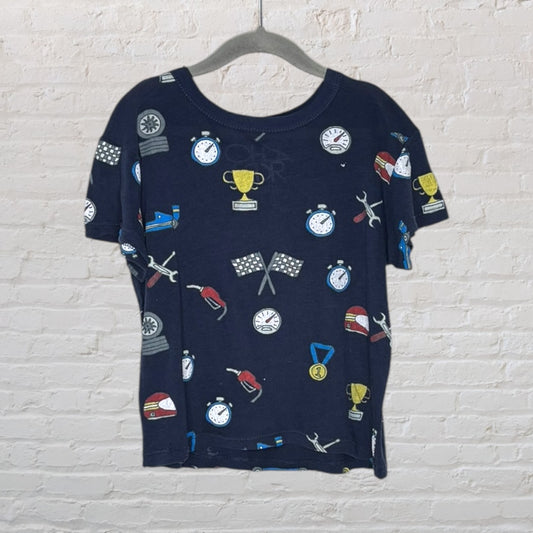 Navy blue T-shirt featuring various racing-themed graphics like trophies, helmets, flags, and stopwatches.