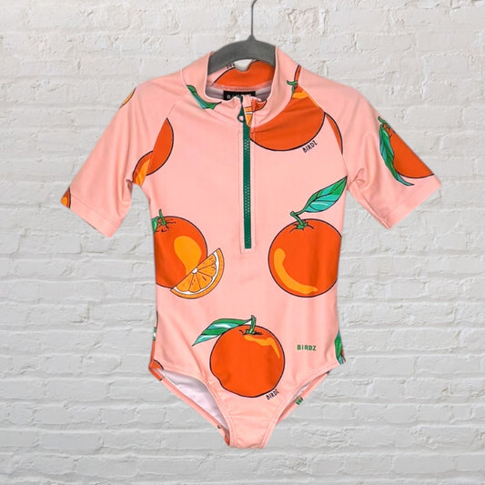 Pink swimsuit with a vibrant orange fruit pattern and a front zipper, designed by Birdz.