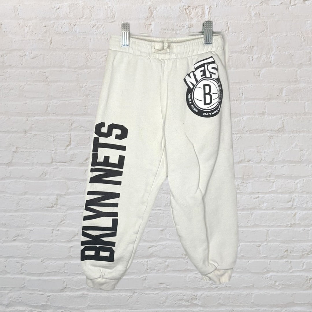 White and black hoodie and sweatpants set with Brooklyn-themed graphic print.
