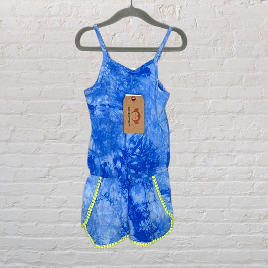 Blue tie-dye romper with neon trim on pockets, displayed on a hanger with a tag attached.