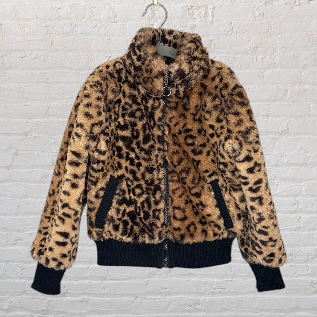 Women's leopard print faux fur jacket with black ribbed cuffs and hem, displayed on a hanger.